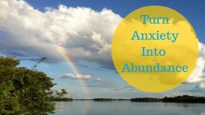 Rainbow and clouds over a lake "turn anxiety into abundance"